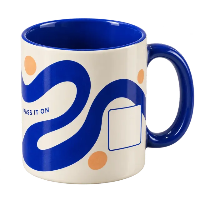 White ceramic mug with a blue handle, wraparound ribbon design and blank code area